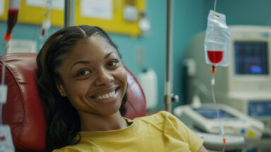 woman smiling during infusion treatment