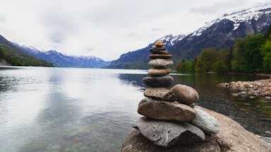 Brown and Gray Stone Stack Near Body of Water