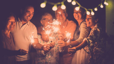 group celebrating with sparklers